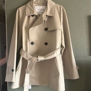 This is an extra large khaki Coach rain jacket.